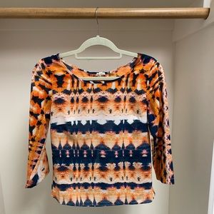 Orange, navy, and white shirt with an open back!